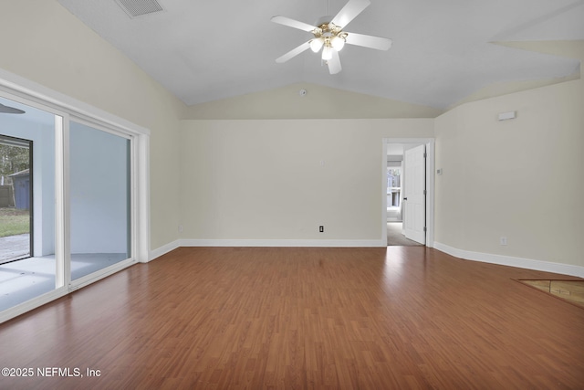 empty room with ceiling fan, wood-type flooring, and lofted ceiling