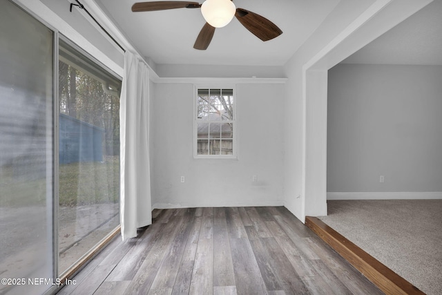 empty room featuring hardwood / wood-style flooring and ceiling fan