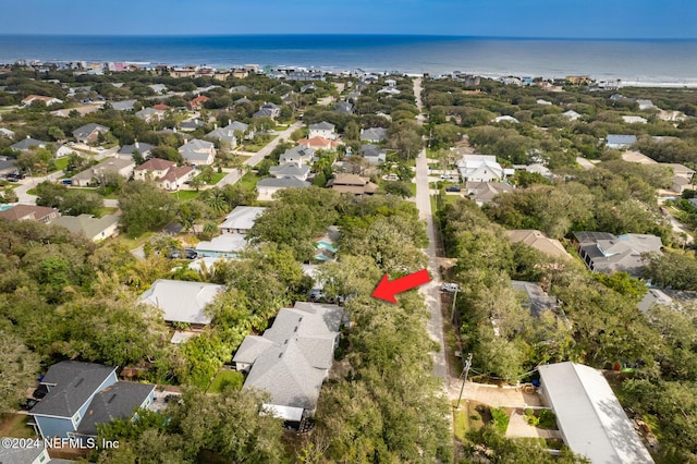 aerial perspective of suburban area featuring a nearby body of water