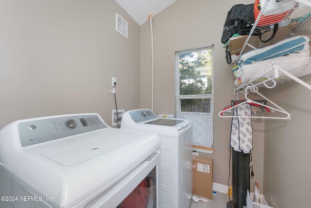 washroom with washing machine and dryer