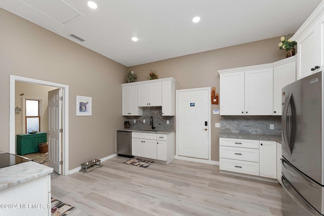 kitchen featuring white cabinetry, sink, and appliances with stainless steel finishes