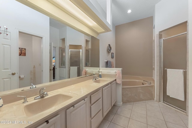 408 Third St, Saint Augustine, FL 32084 - bathroom with a garden tub, a shower stall, double vanity, and tile patterned floors