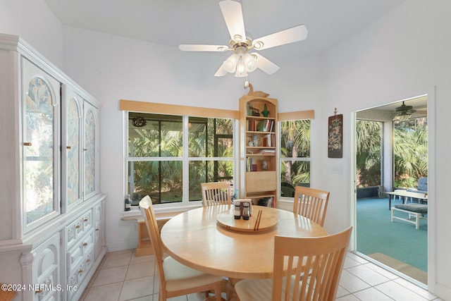 dining room featuring a wealth of natural light, ceiling fan, and light tile patterned flooring