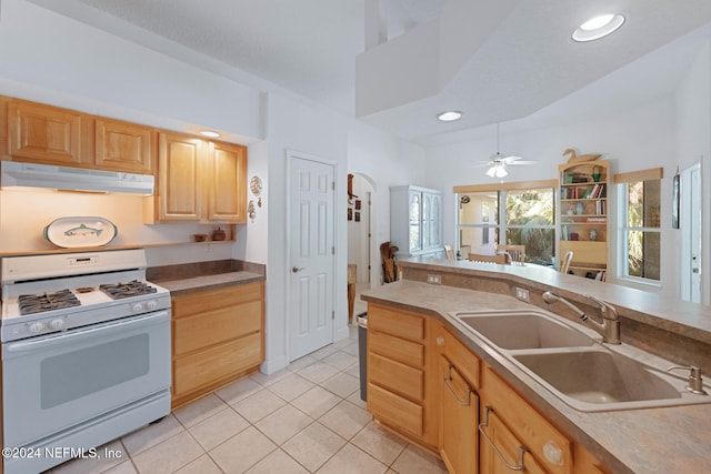 kitchen with light brown cabinetry, ceiling fan, white range with gas cooktop, sink, and light tile patterned floors