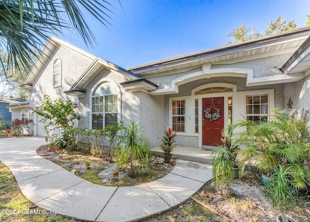 408 Third St, Saint Augustine, FL 32084 - view of exterior entry featuring stucco siding