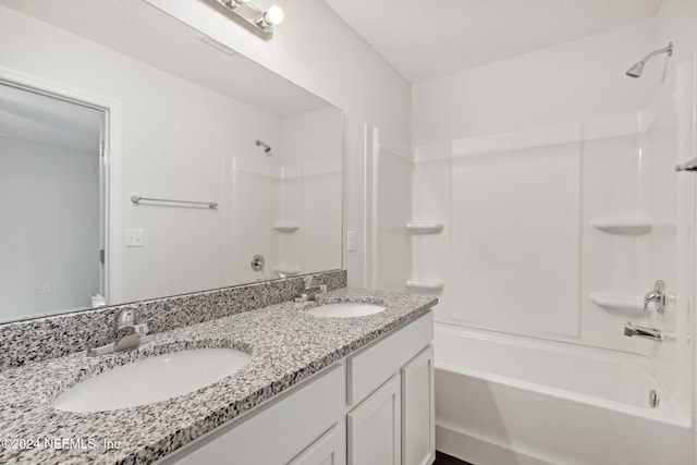 bathroom featuring vanity and shower / bath combination