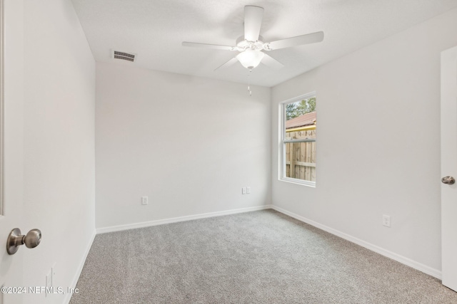 unfurnished room featuring carpet and ceiling fan