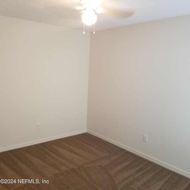 carpeted empty room with ceiling fan