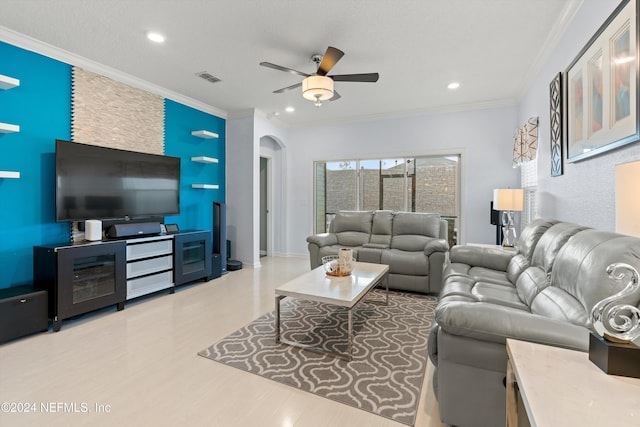 living room featuring ceiling fan and ornamental molding