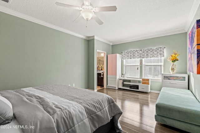 bedroom with ceiling fan, ensuite bathroom, wood-type flooring, and ornamental molding