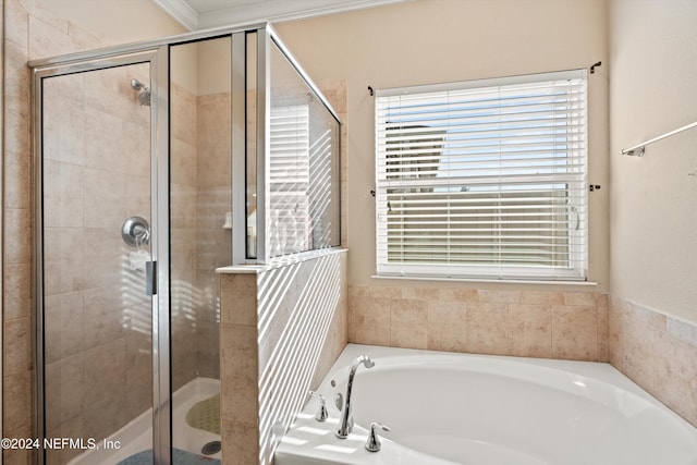 bathroom with independent shower and bath and crown molding