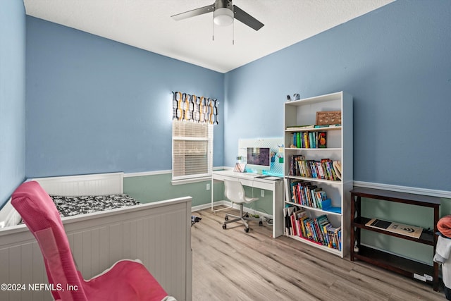 bedroom with ceiling fan and light hardwood / wood-style floors