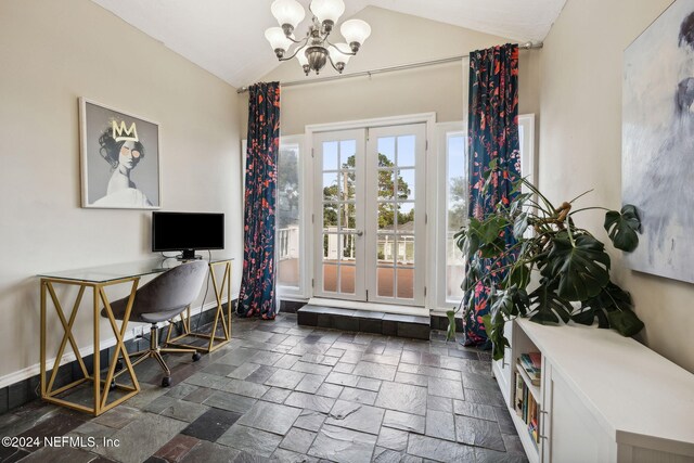 home office with french doors, lofted ceiling, and a notable chandelier