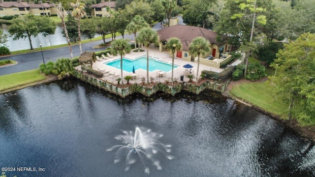 view of swimming pool featuring a water view