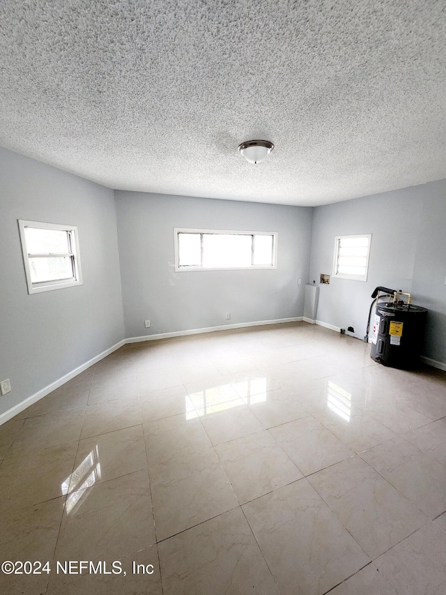 spare room featuring a textured ceiling