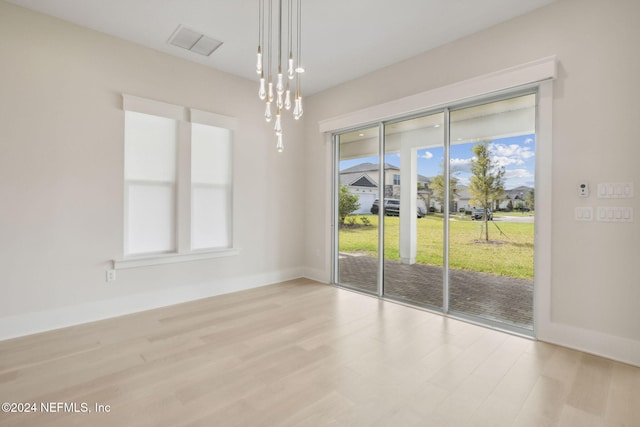 spare room with light wood-type flooring