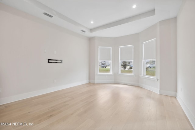 spare room with light hardwood / wood-style floors