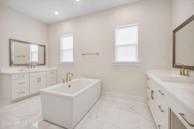 bathroom featuring a bath and vanity