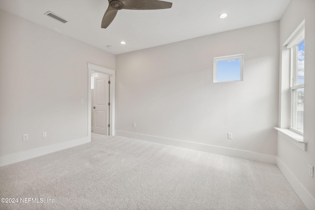 carpeted empty room with ceiling fan