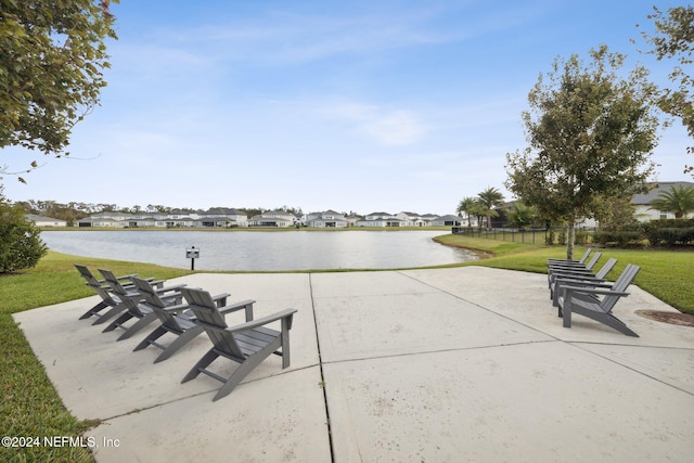 surrounding community featuring a yard and a water view