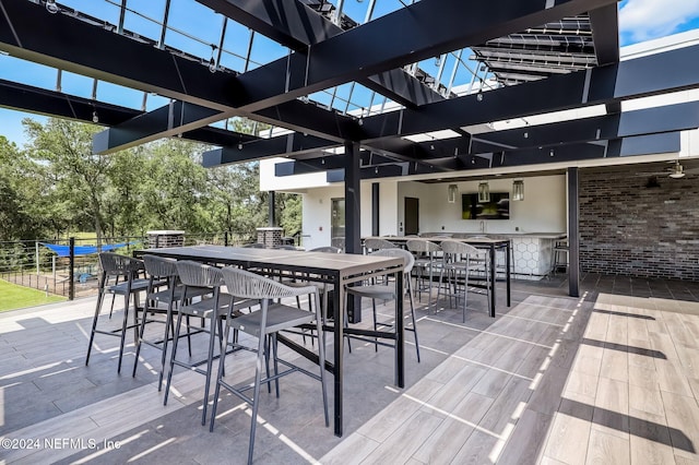 view of patio with an outdoor bar