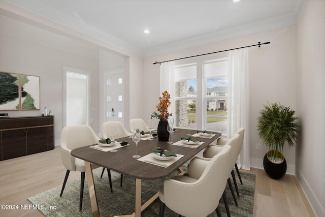 dining space with light hardwood / wood-style floors and crown molding