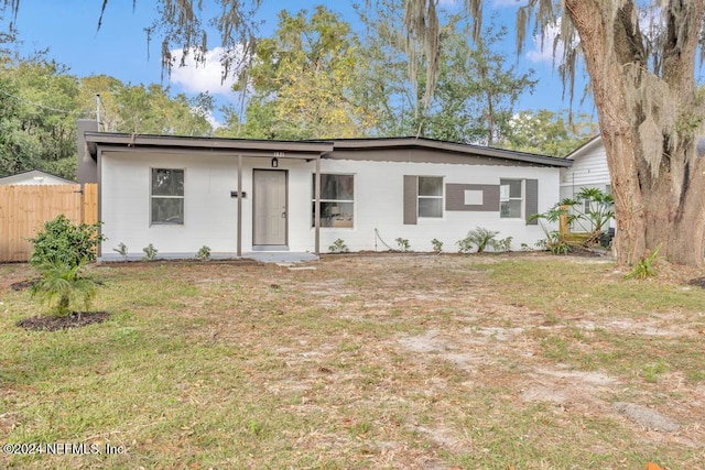 ranch-style house with a front lawn