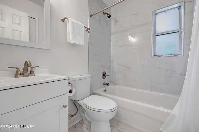 full bathroom with vanity, shower / tub combo, and toilet