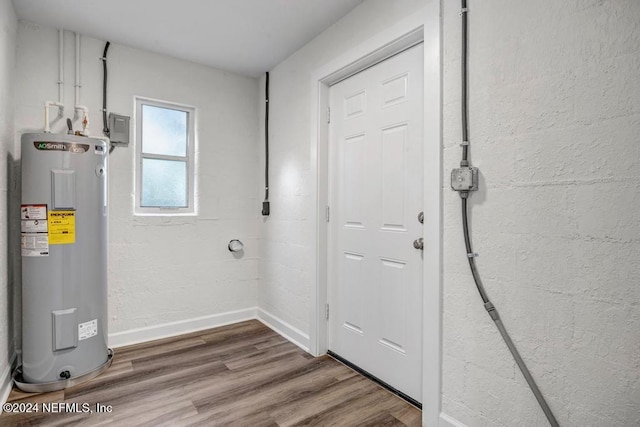 utility room featuring electric water heater