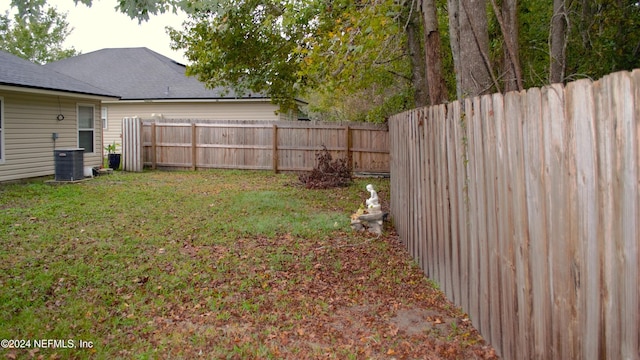 view of yard featuring central AC