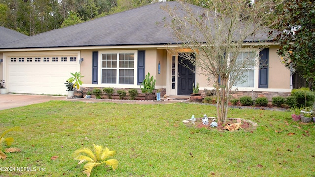 ranch-style home with a garage and a front yard