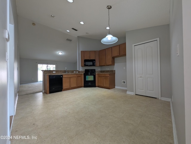 kitchen featuring lofted ceiling, black appliances, sink, decorative light fixtures, and kitchen peninsula