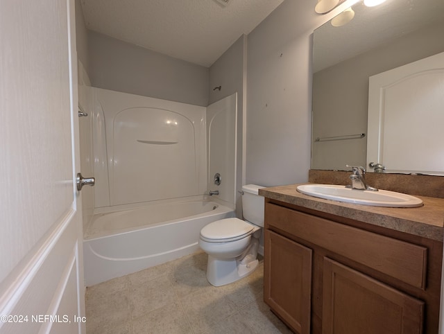 full bathroom featuring vanity, toilet, washtub / shower combination, and a textured ceiling