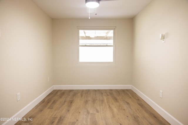 empty room with light wood-type flooring and ceiling fan