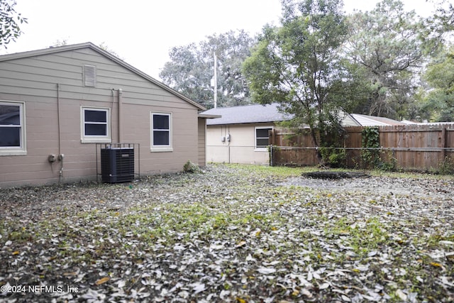 rear view of house with central AC