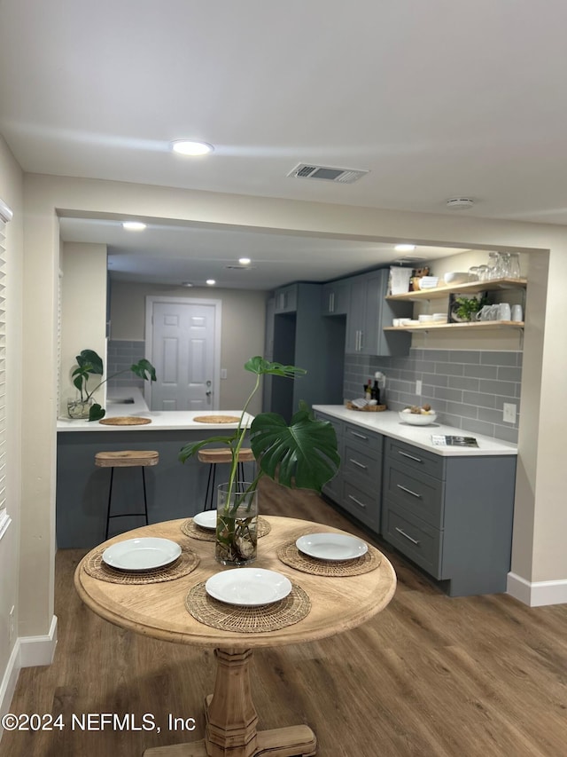 dining area featuring dark hardwood / wood-style floors