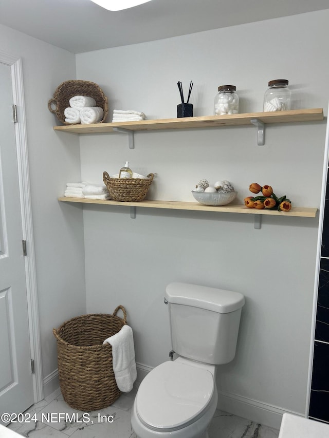 bathroom featuring toilet