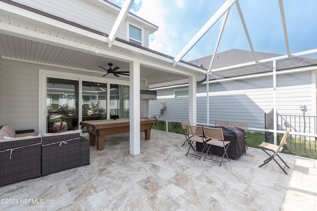 view of patio with ceiling fan, a lanai, a grill, and an outdoor hangout area