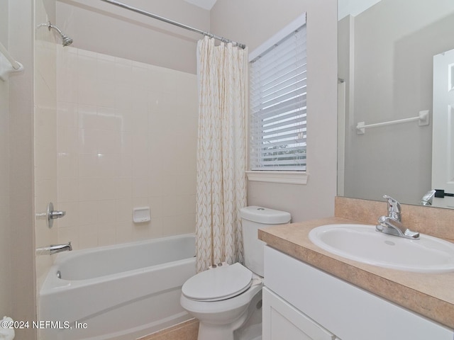 full bathroom with vanity, toilet, and shower / bath combination with curtain