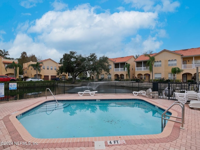 view of swimming pool with a patio area