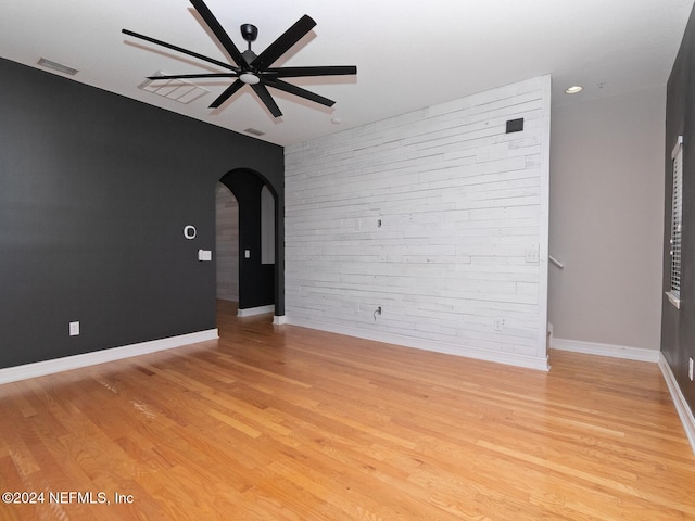 unfurnished room with ceiling fan and light hardwood / wood-style flooring