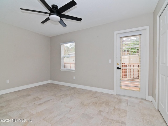 unfurnished room featuring ceiling fan