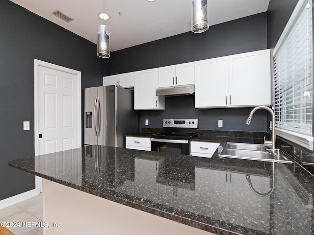 kitchen with stainless steel appliances, white cabinetry, sink, dark stone countertops, and hanging light fixtures