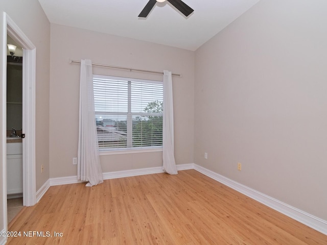 spare room featuring ceiling fan and light hardwood / wood-style flooring