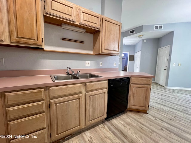 kitchen with kitchen peninsula, sink, black dishwasher, and light hardwood / wood-style flooring