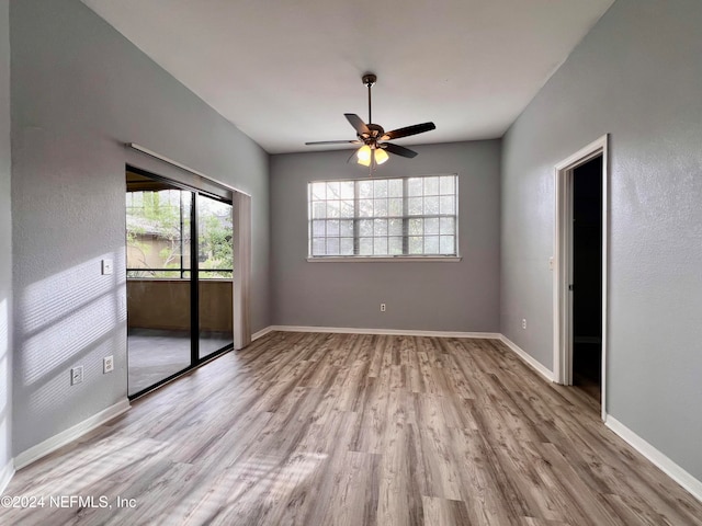 unfurnished room featuring light hardwood / wood-style floors and ceiling fan