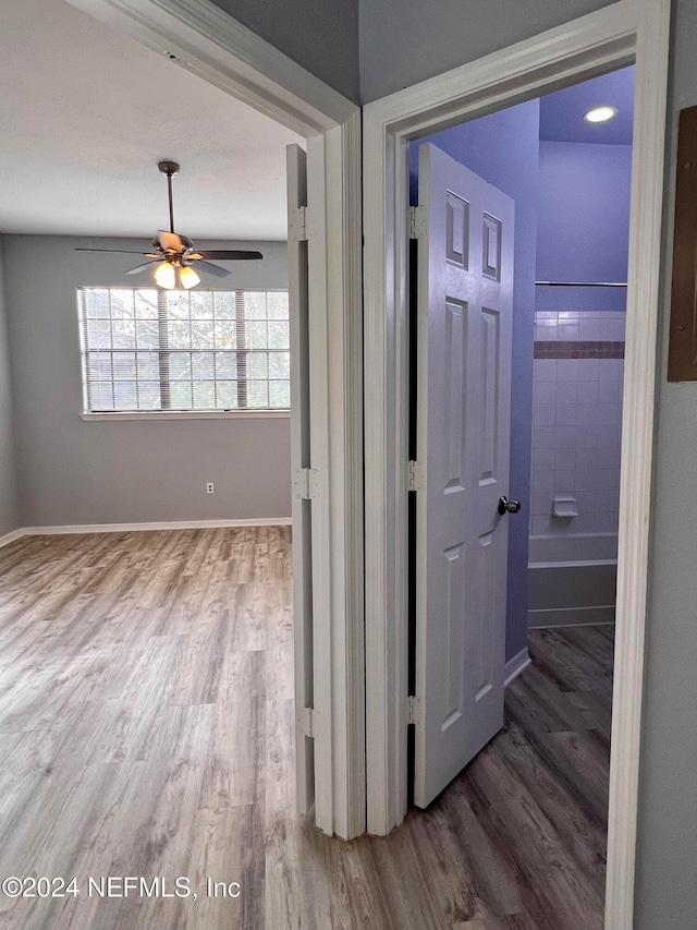 corridor featuring hardwood / wood-style flooring