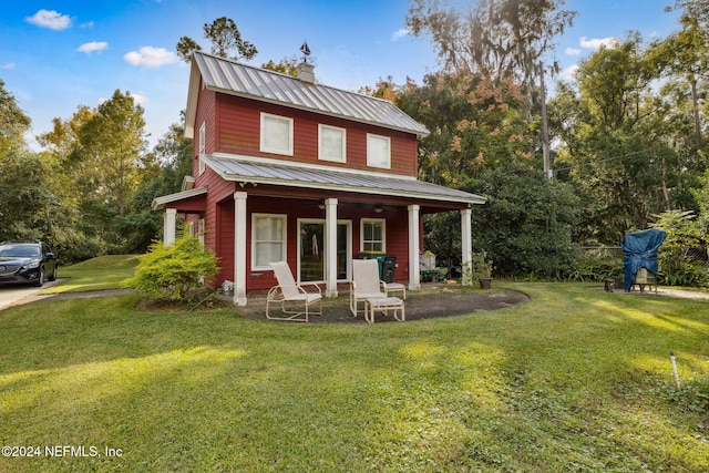 exterior space featuring a porch and a lawn