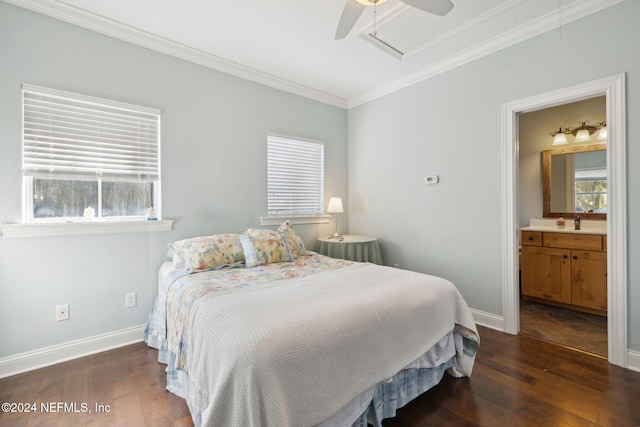 bedroom featuring ensuite bathroom, multiple windows, dark wood-type flooring, and ceiling fan