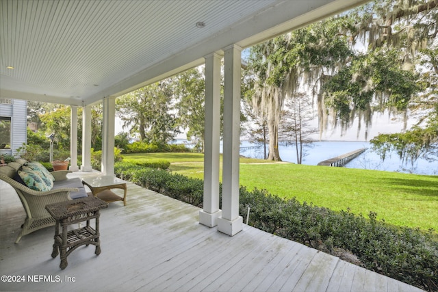 wooden terrace with a yard